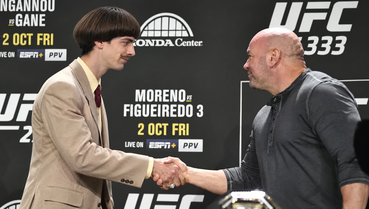 Archibald Brown shaking hands with Dana White at a UFC press conference